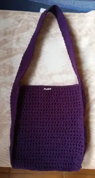 purple crochet bag with toiletry bag inside