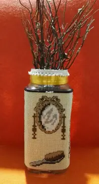 Glass bathroom jar decorated with cross stitch. Pattern by Veronique Enginger