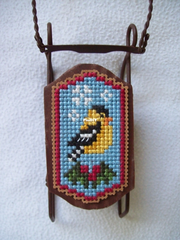 yellow bird sled and green and yellow leaves 007.JPG