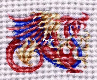 A red and blue dragon breathing gold flames