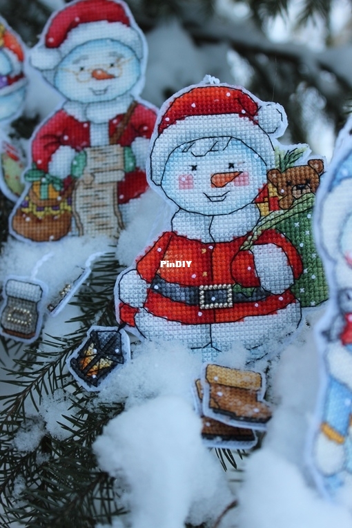 Snowman with a bag of gifts by Elena Shestakova.jpg