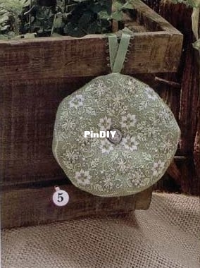 Pamela Kellogg - Poinsettia Biscornu - JCS Xmas'08.jpg