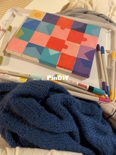 painting and blue vneck sweater.