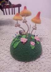 A pincushion in the wood.
