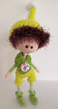An elf boy in green