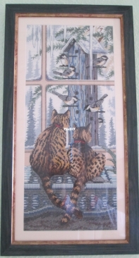 Cats looking out the window for birds