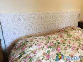 A Bed Headboard with an old crocheted bedspread - my own design