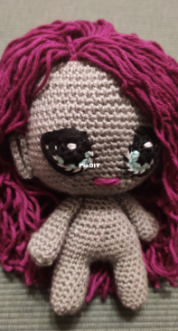 A tiny doll
