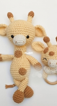 Little giraffe with rattle