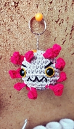 little covid crochet keychain