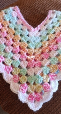 Granny stitch poncho for a baby