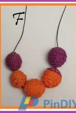 Necklace bead knitted in polymer clay