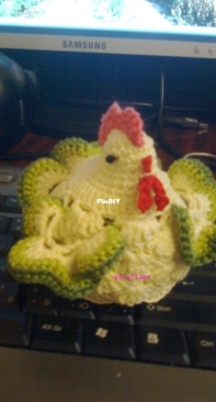 Crocheted hen on an egg