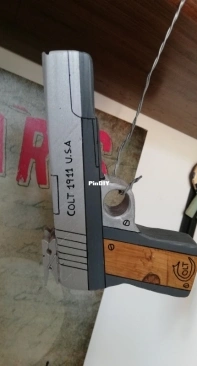 wooden rubber band guns painted with acrylic colors