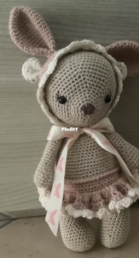 a bear with a rabbit hat
