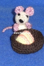 tiny mouse in its bed