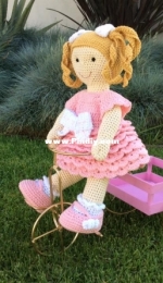 Doll riding a bike