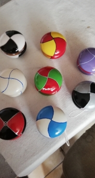 wooden yo-yo painted with acrylic colors