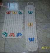 A rug and a toilet paper cover
