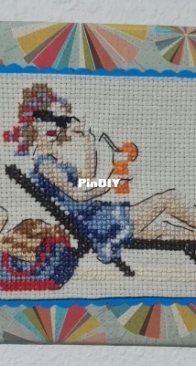 woman sunbathing cross stitch painting. Design by Veronique Enginger