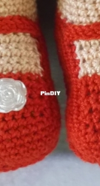 a doll in white and red outfit