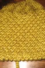 Green-yellow bonnets for a baby