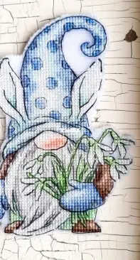 Dwarf with snowdrops