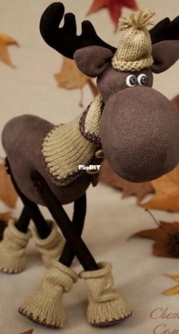 Reindeer in fabric and knitted clothes by Svetlana Semenova