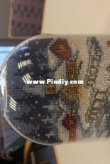 Snowglobe with cross stitch