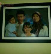 my cousins family on cross stitch - Framed