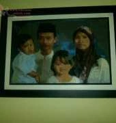 my cousins family on cross stitch - Framed