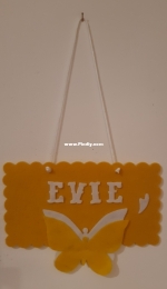 Yellow felt wall hanging