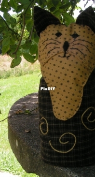 Interpretation of "Kitty Door Stop" (Wee Folk Art)