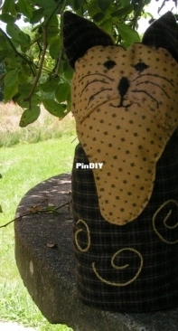 Interpretation of "Kitty Door Stop" (Wee Folk Art)