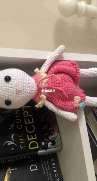 Bunny on a bookshelf