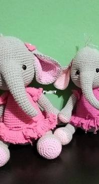 Two elephants in pink dresses