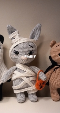 Bear, bunny and cat in Halloween costumes  by Yana Batalova