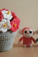 a little monkey and pot plant