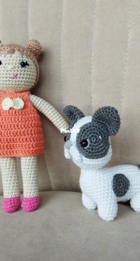 A little doll with a french bulldog