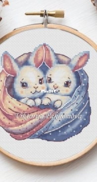 Bunnies in a blanket by Viktoriia / Victoria Pakhomova