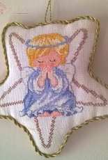 angel praying into a star