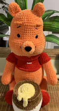 Winnie the Pooh and his honey pot