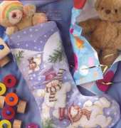 Tumbling Snowmen Stocking by Lucie Heaton from Cross Stitch Gold 26 XSD