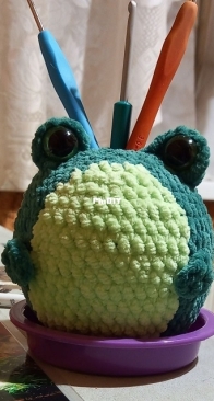 Frog-holder for crochet hooks.