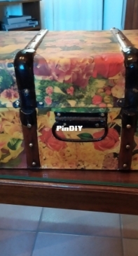 Decoupage on a vintage wooden suitcase