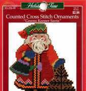 Holiday time greens keeper santa ornament