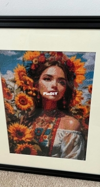 Ukrainian Woman in Sunflower Field