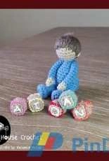 Cubby House Crochet- Veronica McRae -Sitting Toddler Aidan With building blocks