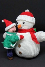 Little girl and snowman