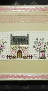 wooden box decorated with cross stitch pattern